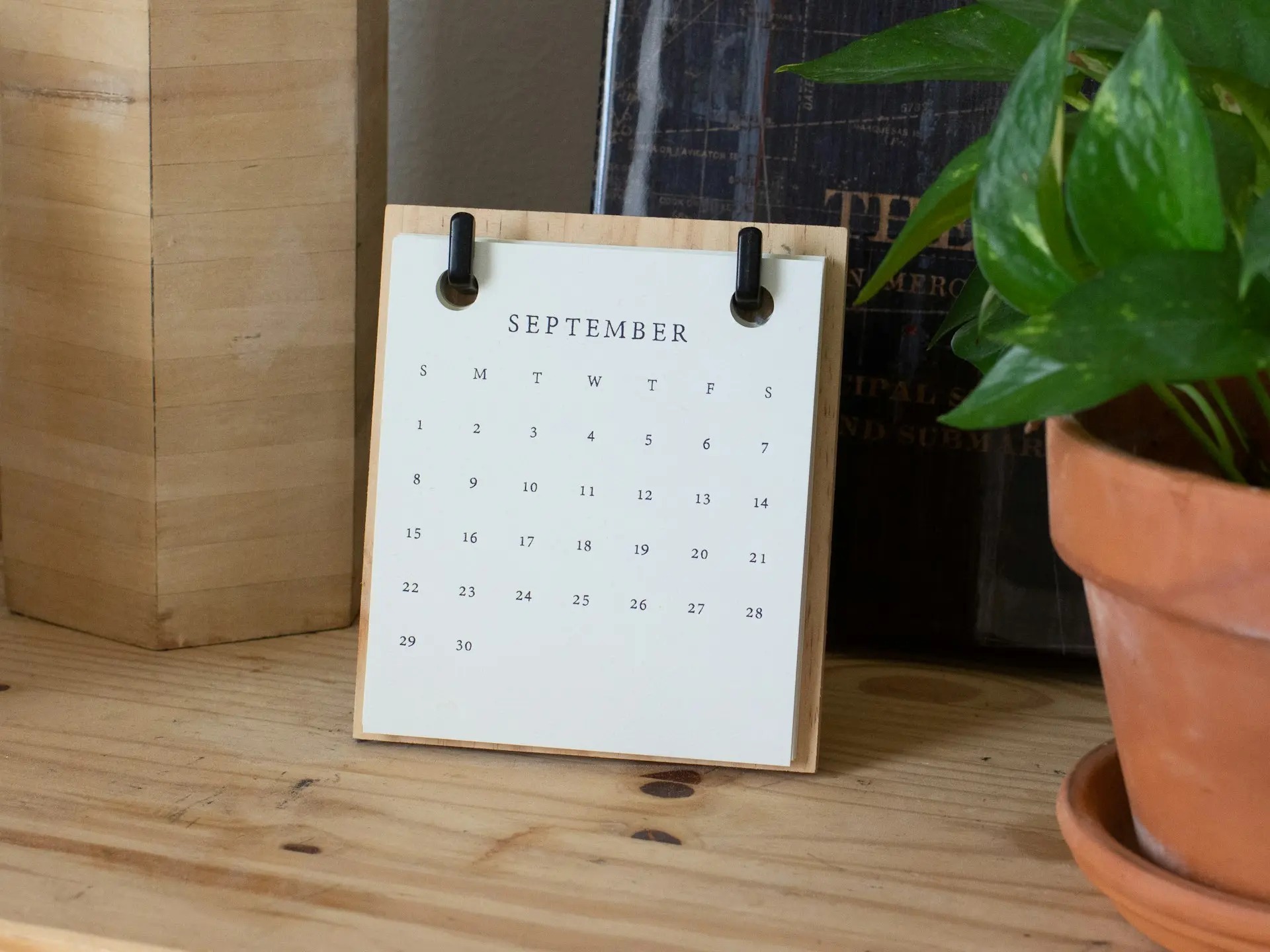 white braille paper on brown wooden table